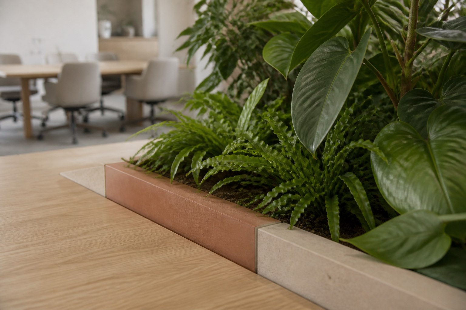 Concept image of a built-in workplace planter beside a shared table